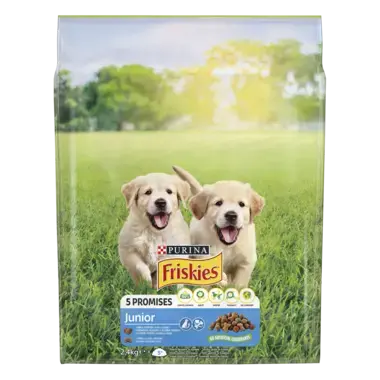 Friskies® Junior (джуніор). З куркою, овочами та молоком*. Сухий повнораціонний корм для цуценят віком від 6 тижнів.